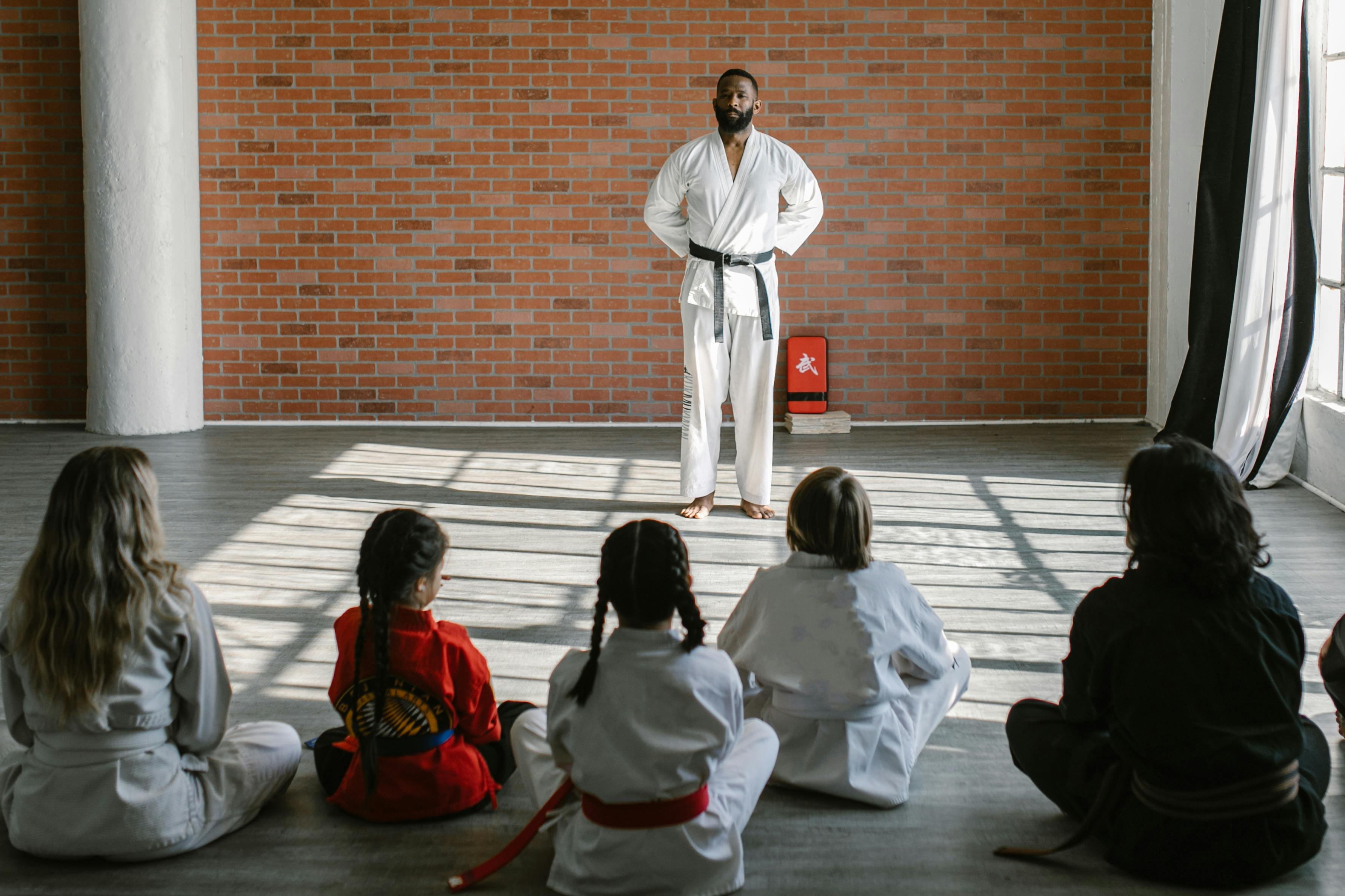 Adult BJJ practitioner training on the mat with a training partner