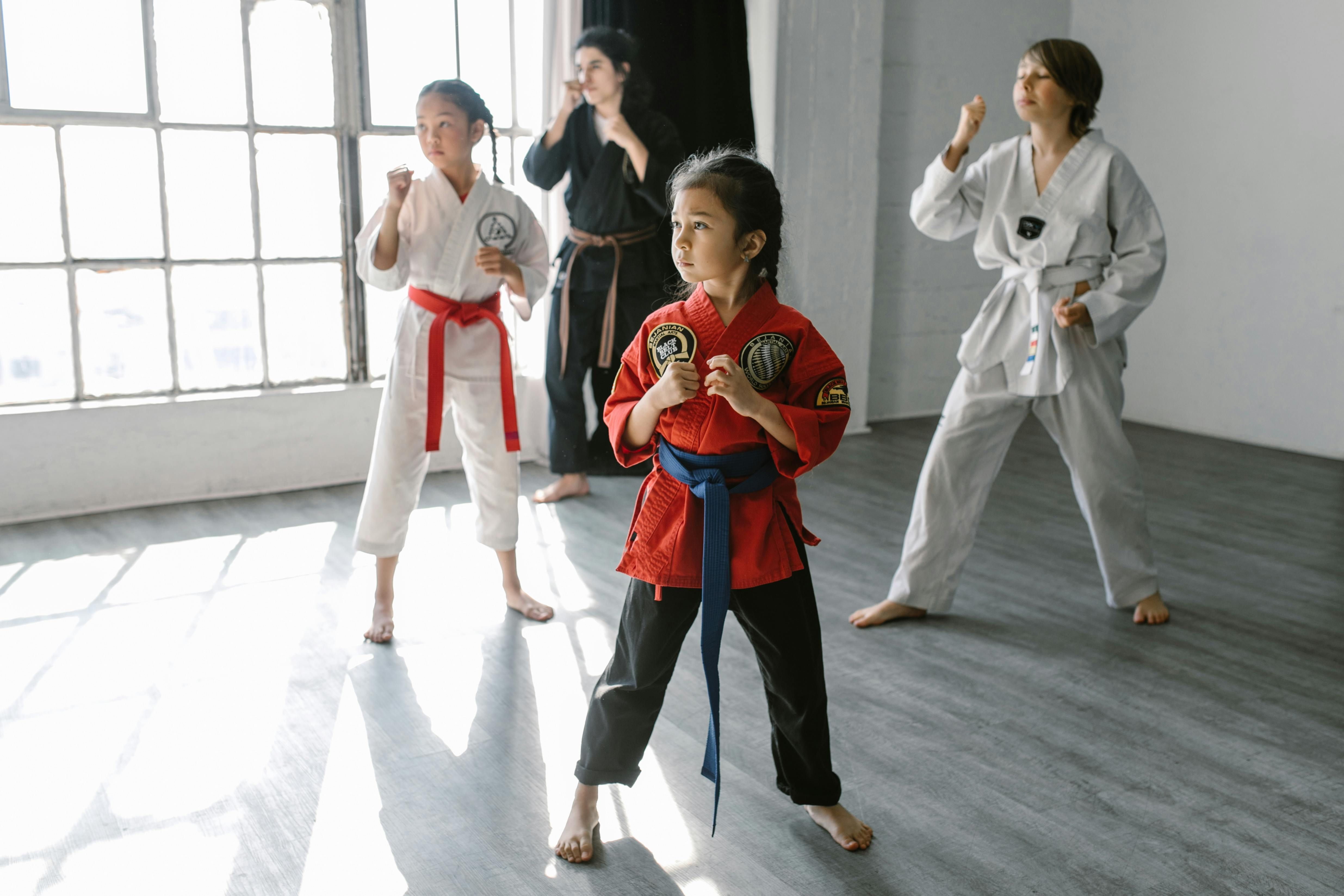 BJJ students training on the mats at a martial arts academy
