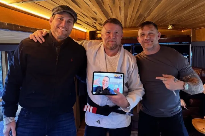 Guy Ritchie receiving his BJJ third-degree black belt alongside Tom Hardy