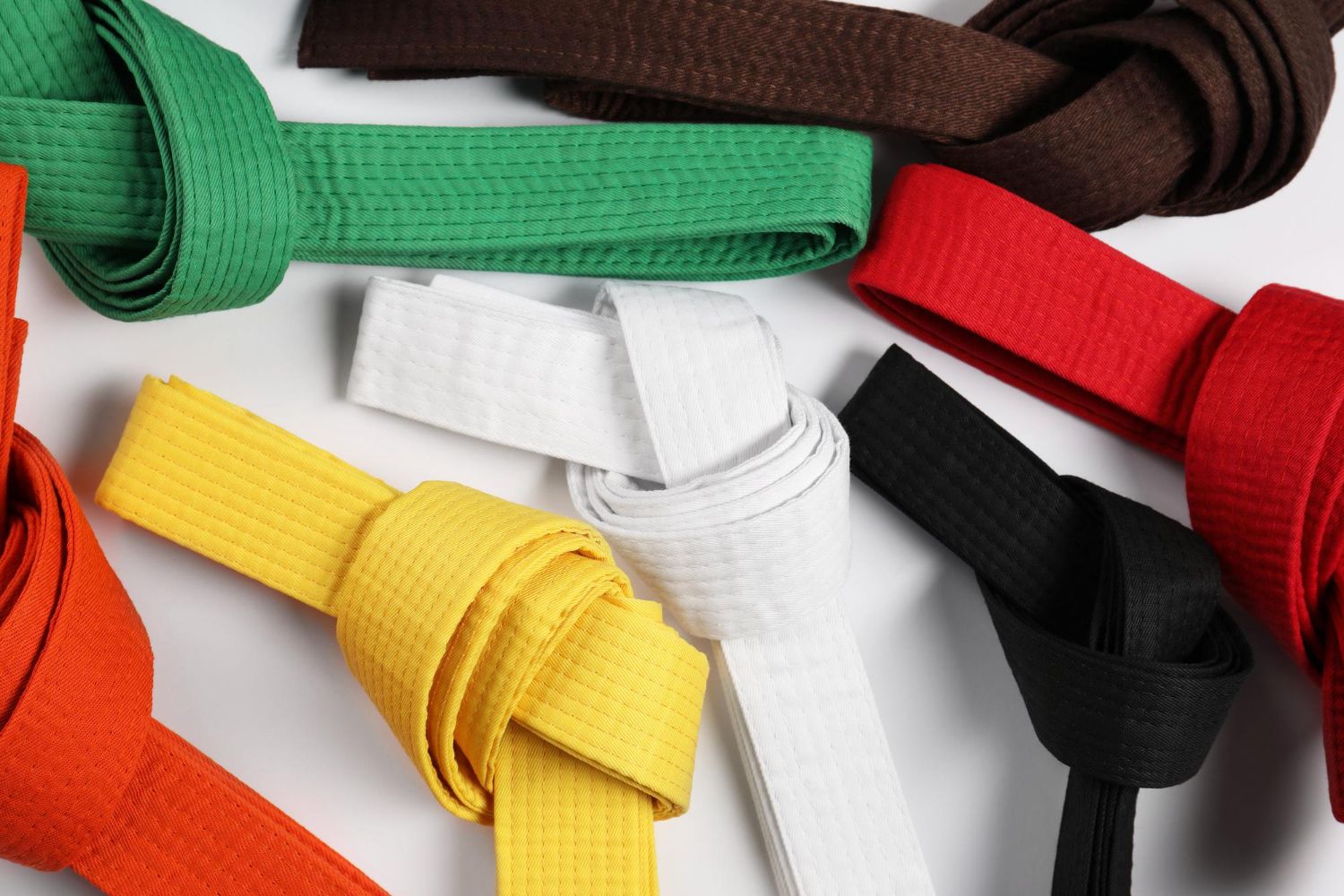 Martial arts belts in color order